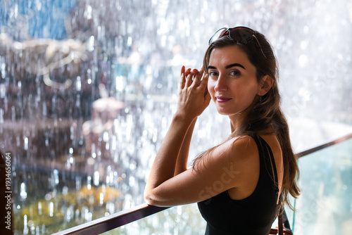 girl in front of a waterfall