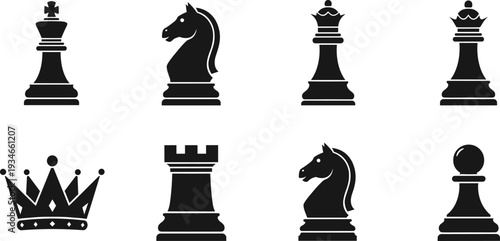 Collection of black chess pieces and a crown on a white background