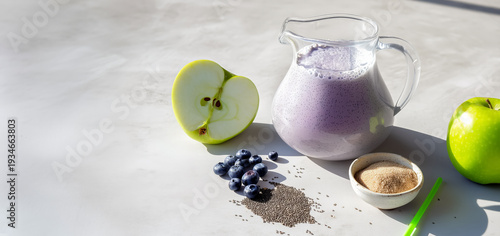 Wallpaper Mural pitcher filled with a protein shake with black chia seed suspension, berries and shake ingredients on a table, copy space for the concept of a healthy balanced diet Torontodigital.ca