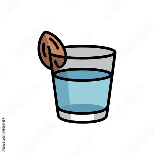 Glass tumbler holds a light blue beverage garnished with a sliced brown nut on the rim.
