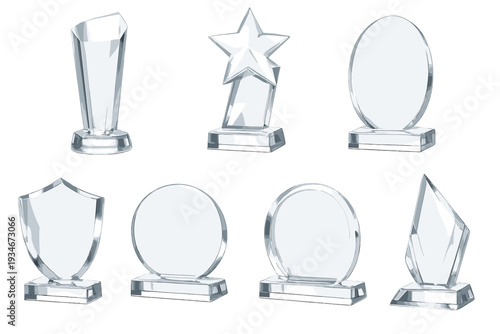 Various clear glass trophies displayed on a white background