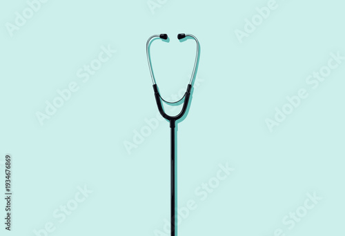 Sleek Black Stethoscope Standing Against Aqua Background Symbolizing Healthcare and Medical Precision