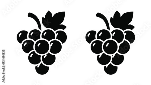 Two bunches of grapes depicted in a stark black silhouette