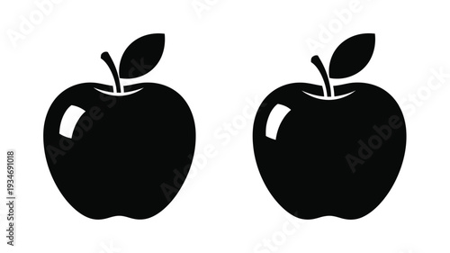 Two dark apples shown side by side in black silhouette
