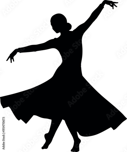 silhouette of a female dancer in a flowing dress performing a ballet pose