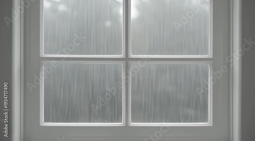 Four pane window with textured glass obscuring an out-of-focus outdoor scene