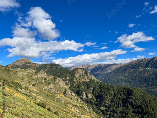 Pyrenees Orientales mountains under a blue sky with clouds