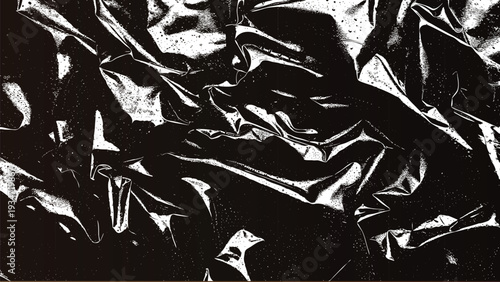 Abstract black and white crumpled fabric with high contrast and dramatic shadows