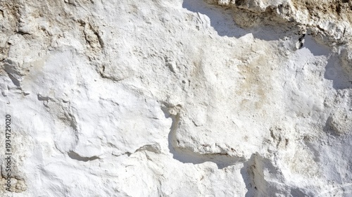 Close-up of rough white chalk cliff surface with texture details