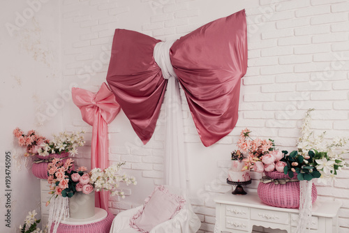 the interior of the room of a teenage girl who loves pink and fluffy bows. Flower vases made of environmentally friendly plastic, wooden dressers with aristocratic moldings