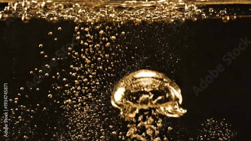 Wallpaper Mural Golden liquid churns with dynamic bubbles and a singular large bubble Torontodigital.ca