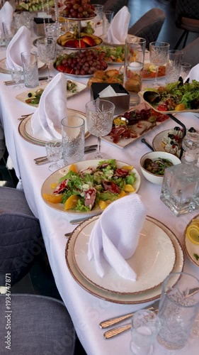 Guests seated at wedding banquet table with food