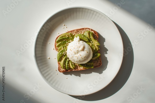 Wallpaper Mural Avocado toast with poached egg and sesame seeds served on minimal ceramic plate Torontodigital.ca
