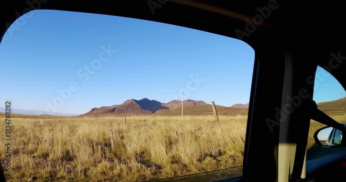 Site window pov drive on dirt road through volcanic mountain in remote wilderness on rural scene in Iceland