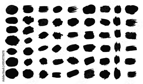 A collection of varied black brush strokes and dots on a white background