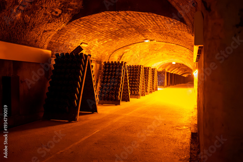 Canvas Print Riddling or remuage sediment to the bottle neckin deep underground caves on pupi