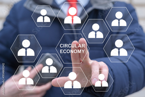 Concept of circular economy. Business person using virtual touch screen presses the inscription CIRCULAR ECONOMY.