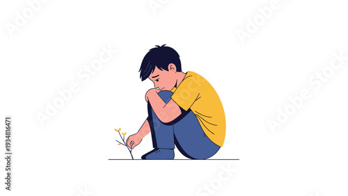 Lonely and sad young boy sitting on the ground hugging his knees while looking down at a small delicate flower on a minimal white background.