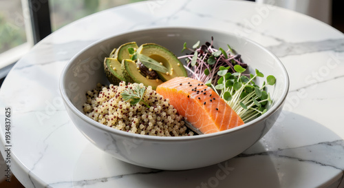 Gourmet Healthy Bowl with Salmon and Quinoa on Marble Table