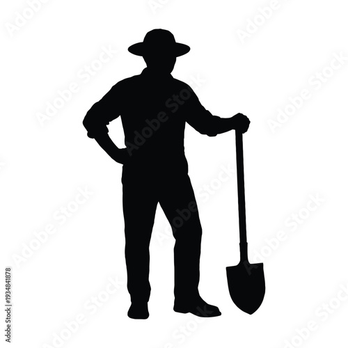 silhouette of a man with shovel