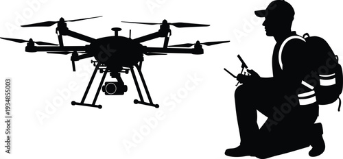 Black silhouette of a male pilot kneeling and operating a professional hexacopter drone with remote control for aerial photography and surveillance