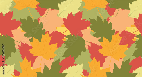Warm autumn themed seamless pattern showcasing a dense arrangement of fallen maple and oak leaves in various fall colors for backdrops.