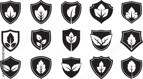 Black and white leaf shield icons on white background