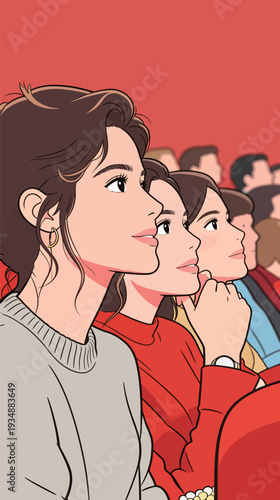 Three women sit in the front row of a theater, watching a movie. The audience is engaged and focused on the screen.