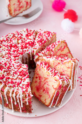 Pound cake baked in a Bundt pan with pink sprinkles for Valentines Day