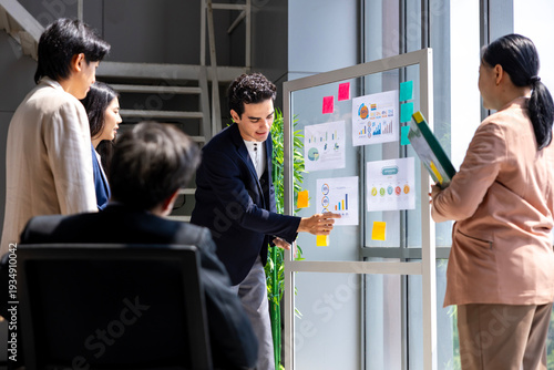 Team of young caucasian entrepreneur have small team meeting for project for marketing and sale management with skyscraper view for business startup and education