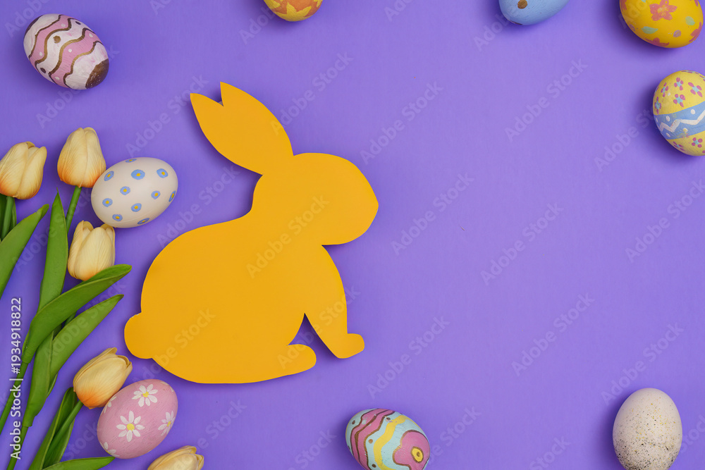 Obraz premium Easter Bunny. Yellow bunny silhouette surrounded by colorful eggs on a purple background.