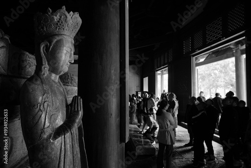 Buddha statue and believer,  ZhengDing, China