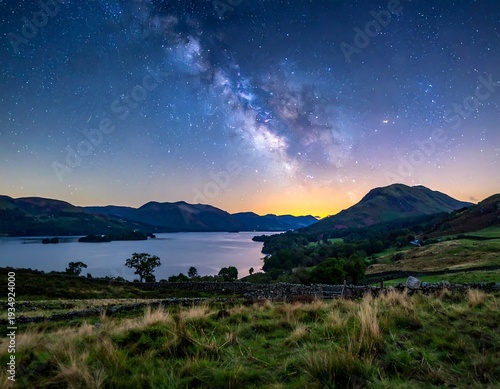 Stunning nightscape shows lake, rolling hills, fields under a bright, starry Milky Way galaxy