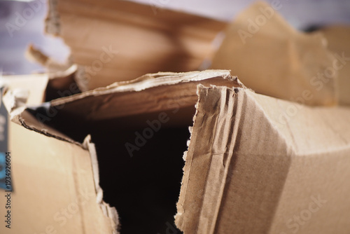 Fényképezés Cardboard box opened and damaged on a table