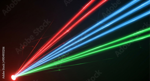 Three vibrant laser beams of red blue and green light emanating from a single source.