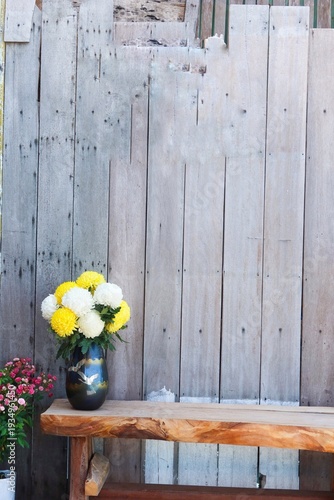 yellow flowers on a wooden background