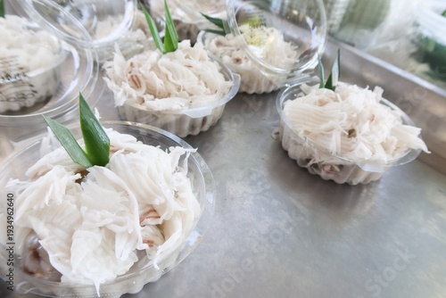 Khanom Tom is a traditional Thai dessert made from glutinous rice flour, filled with grated coconut stir-fried with palm sugar.