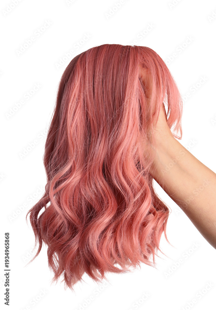 Fototapeta premium Female hand with pink wig isolated on white background
