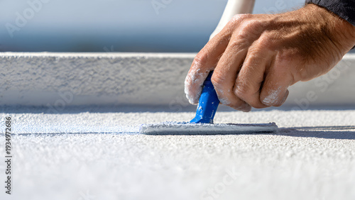 Ultra-realistic close-up of men’s hands in gray gloves holding yellow cordless screwdriver with rubberized grip, screw countersinking neatly into roofing sheet
