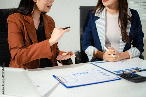 Business professionals signing legal contract with lawyer in corporate office, concept of agreement, compliance, negotiation, finance and professional consultation.