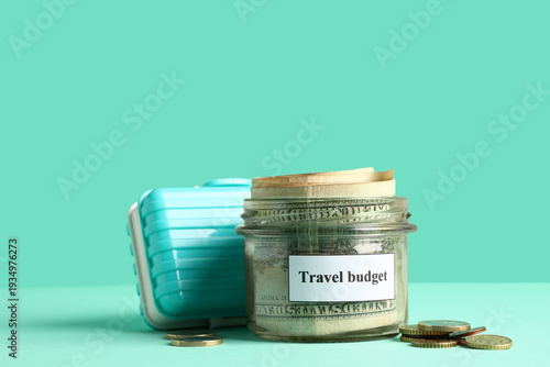 Money jar with toy suitcase...