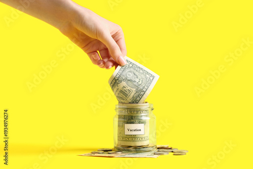 Female hand putting money i...