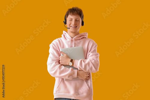 Happy young man in headset ...