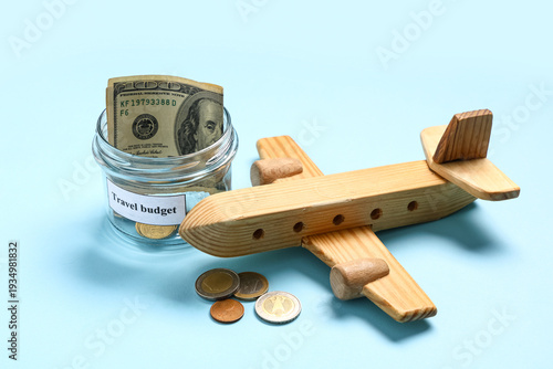Money jar with wooden airpl...
