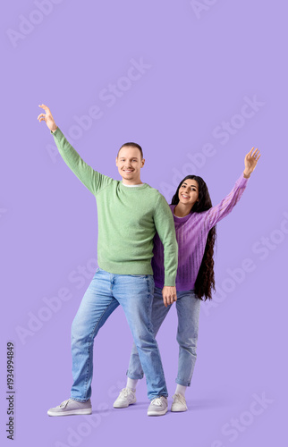Happy young couple in warm ...