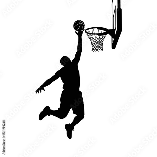 Basketball player performing a slam dunk in silhouette