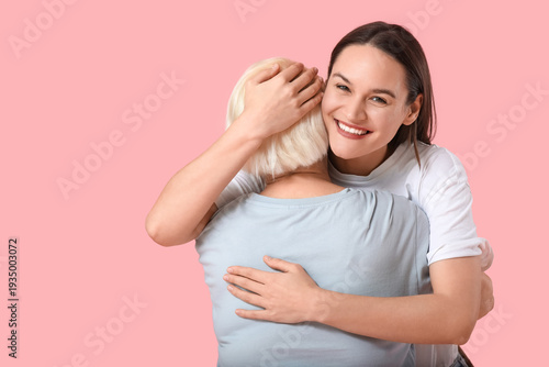 Young woman hugging her gra...