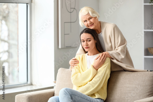 Senior woman hugging her sa...