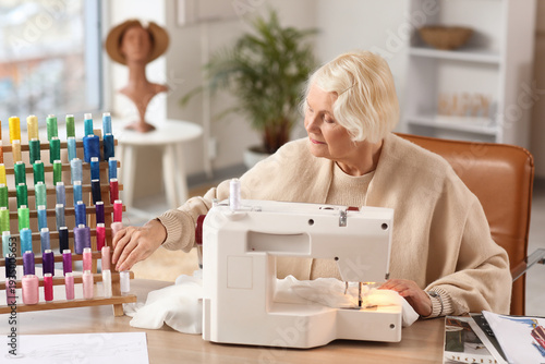 Senior female tailor with t...