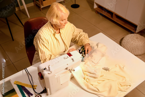 Senior female tailor with t...